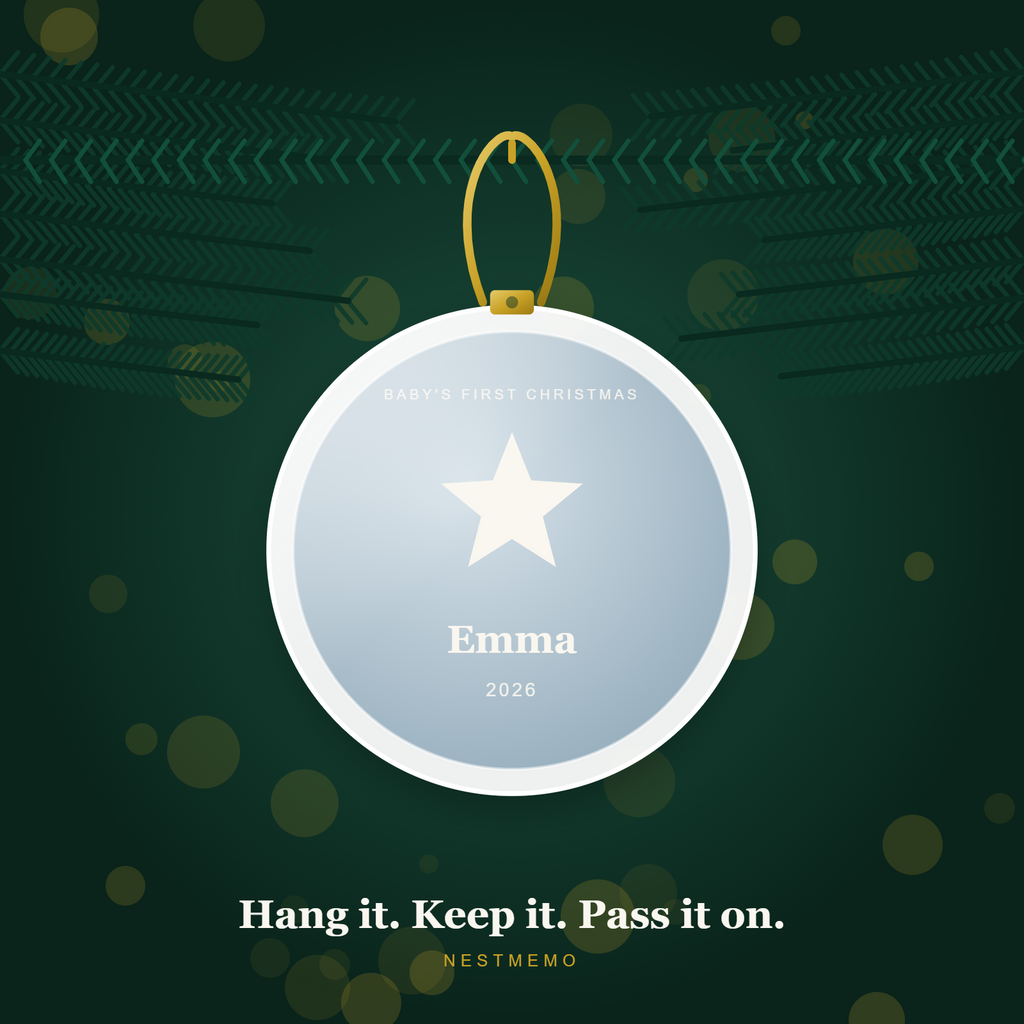 Baby's first Christmas ornament hanging on an evergreen branch