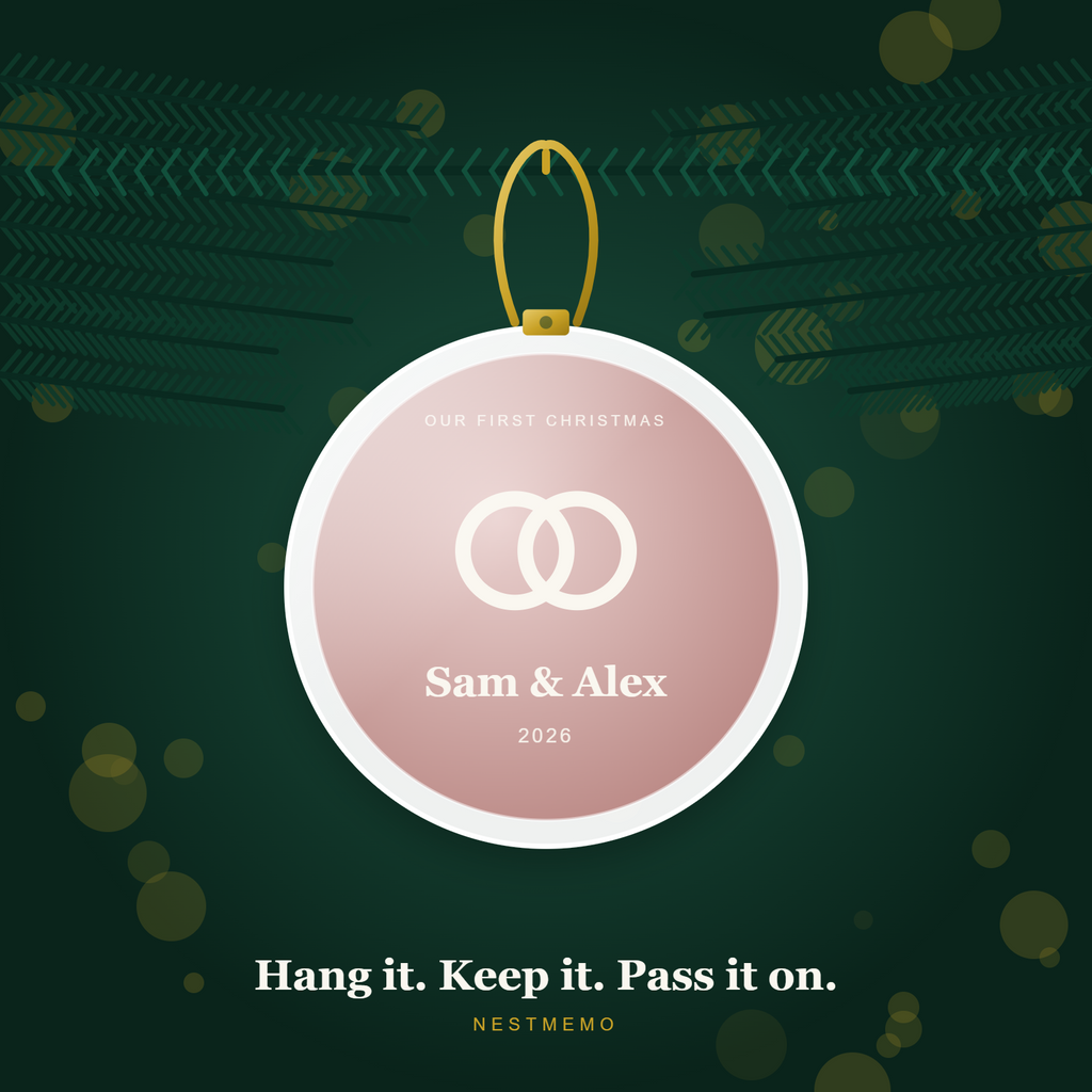 Couple ornament hanging on an evergreen branch